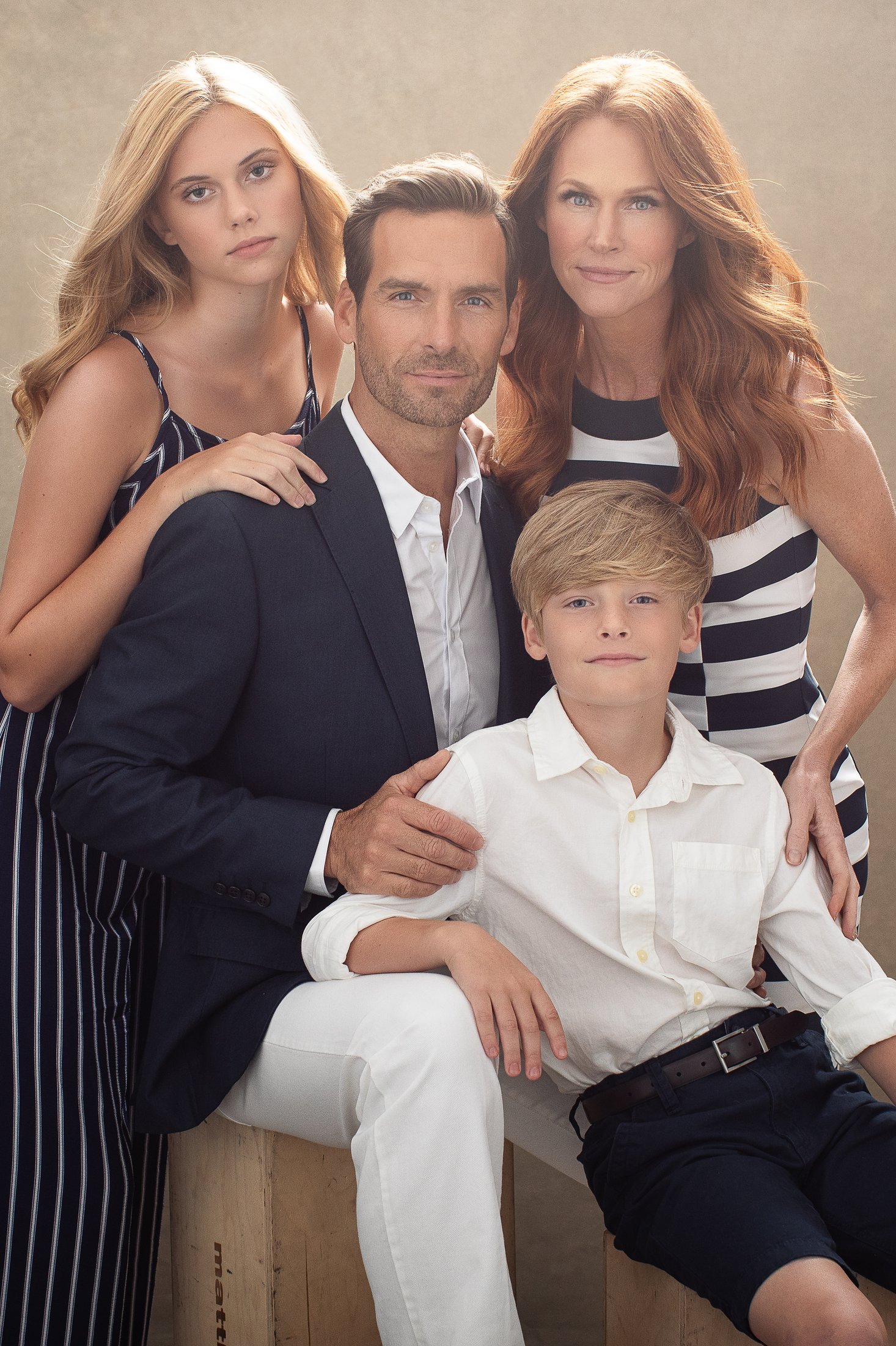 Family of four in a soft backlit studio portrait, Dallas