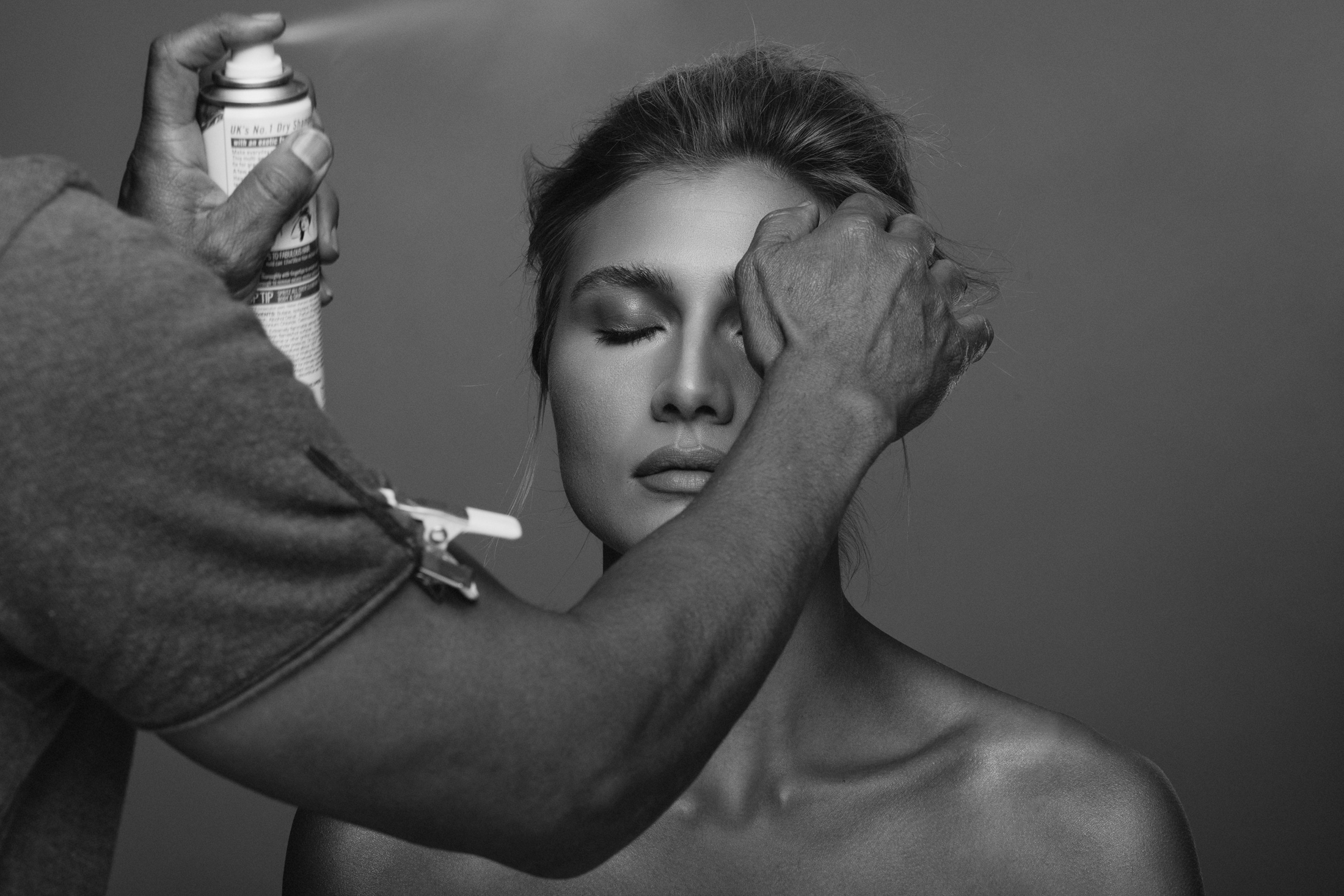 Professional hairstyling during a photo shoot at the AJK Images Dallas studio