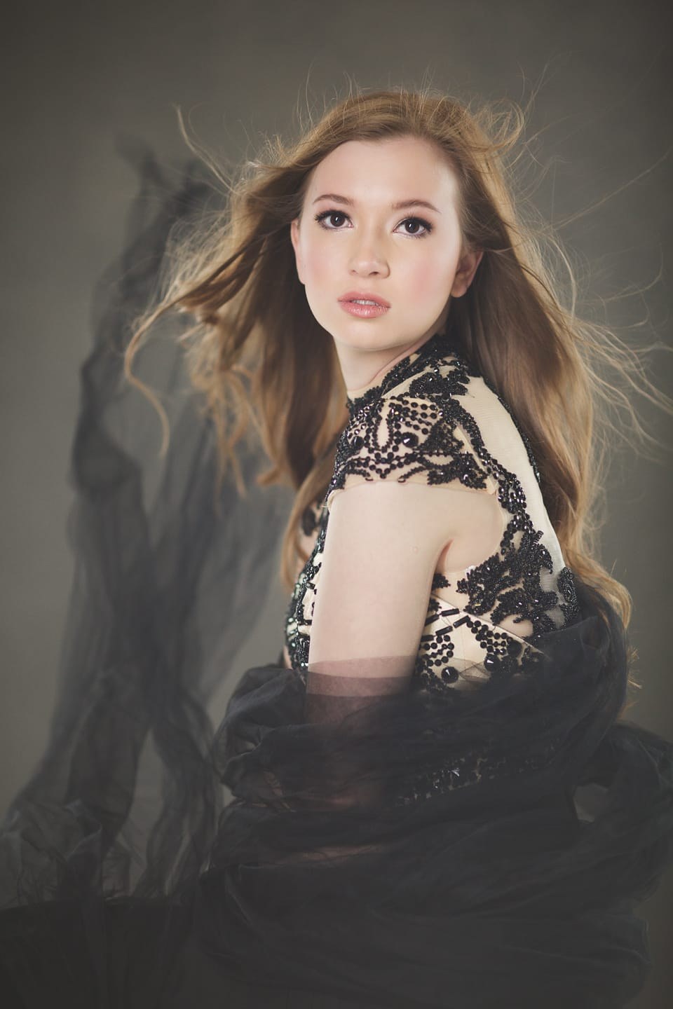 Studio portrait against a hand-painted warm gray Oliphant canvas backdrop, AJK Images Dallas
