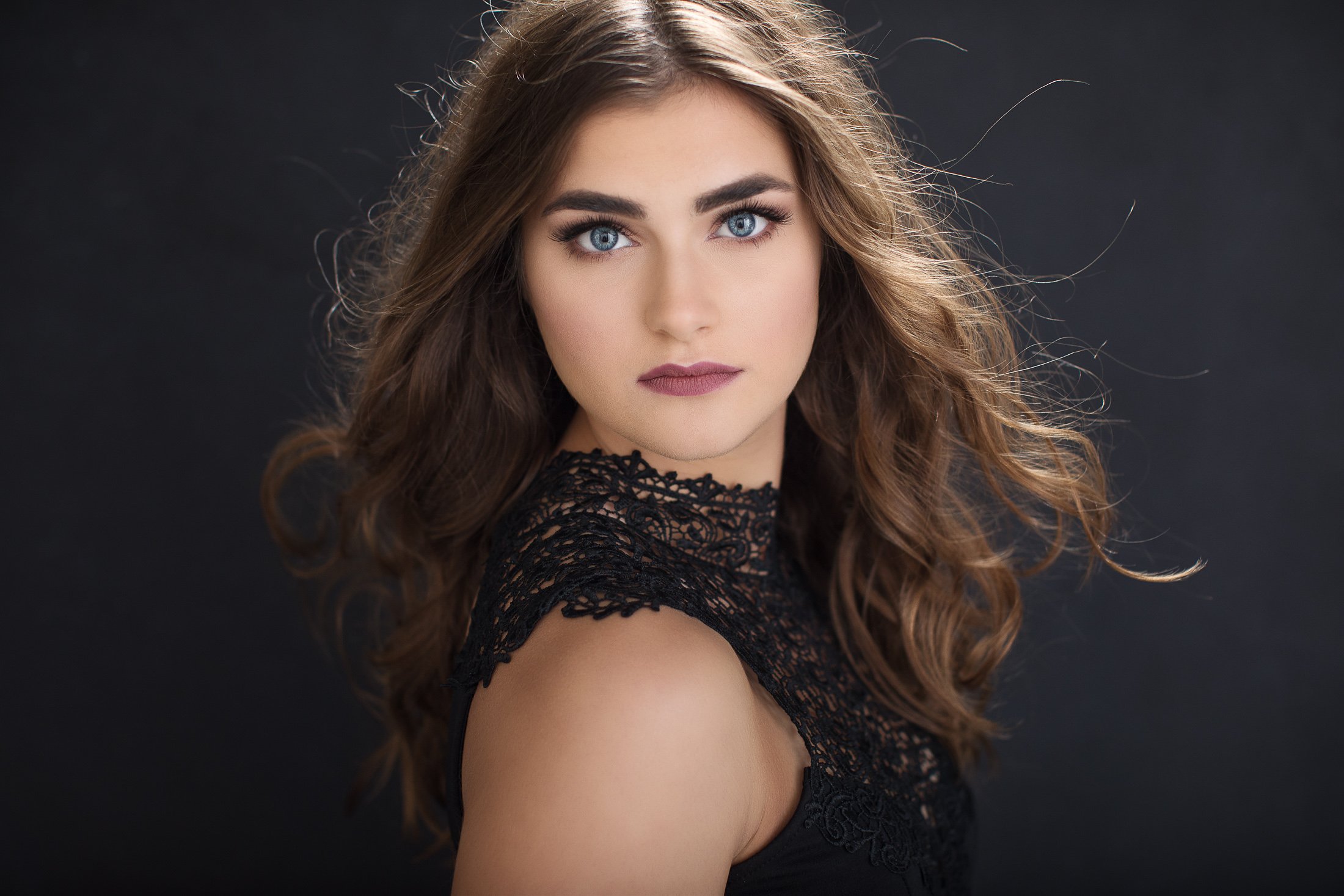 Studio portrait in black lace with hair in motion, AJK Images Dallas