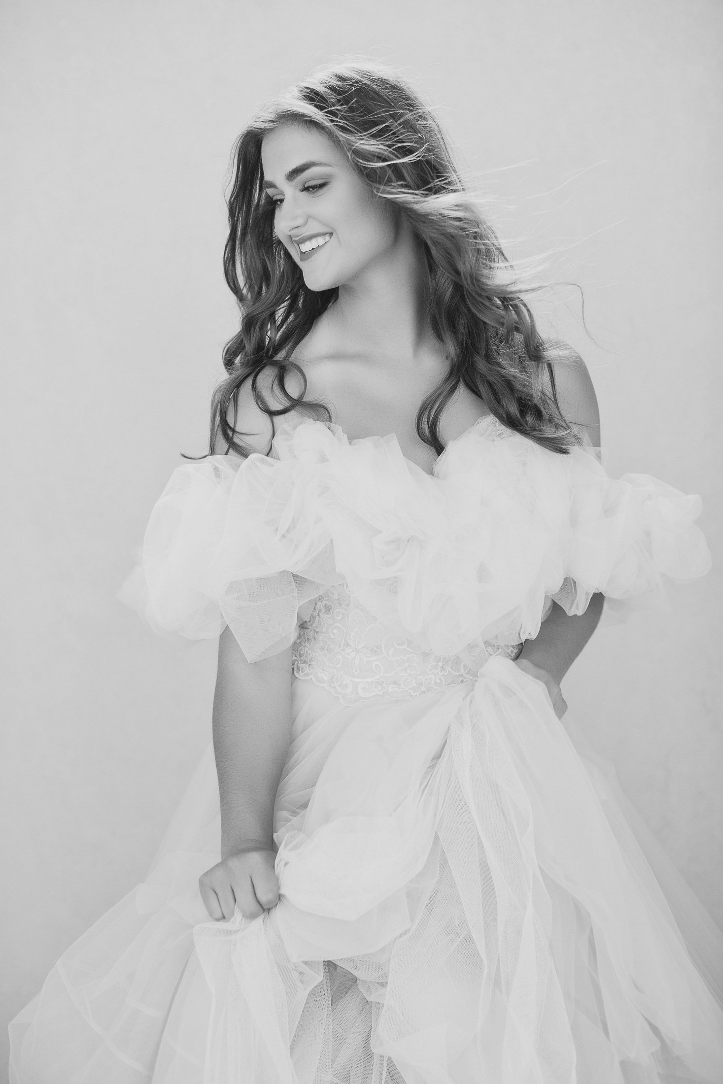 Black and white portrait laughing in a tulle gown, AJK Images studio