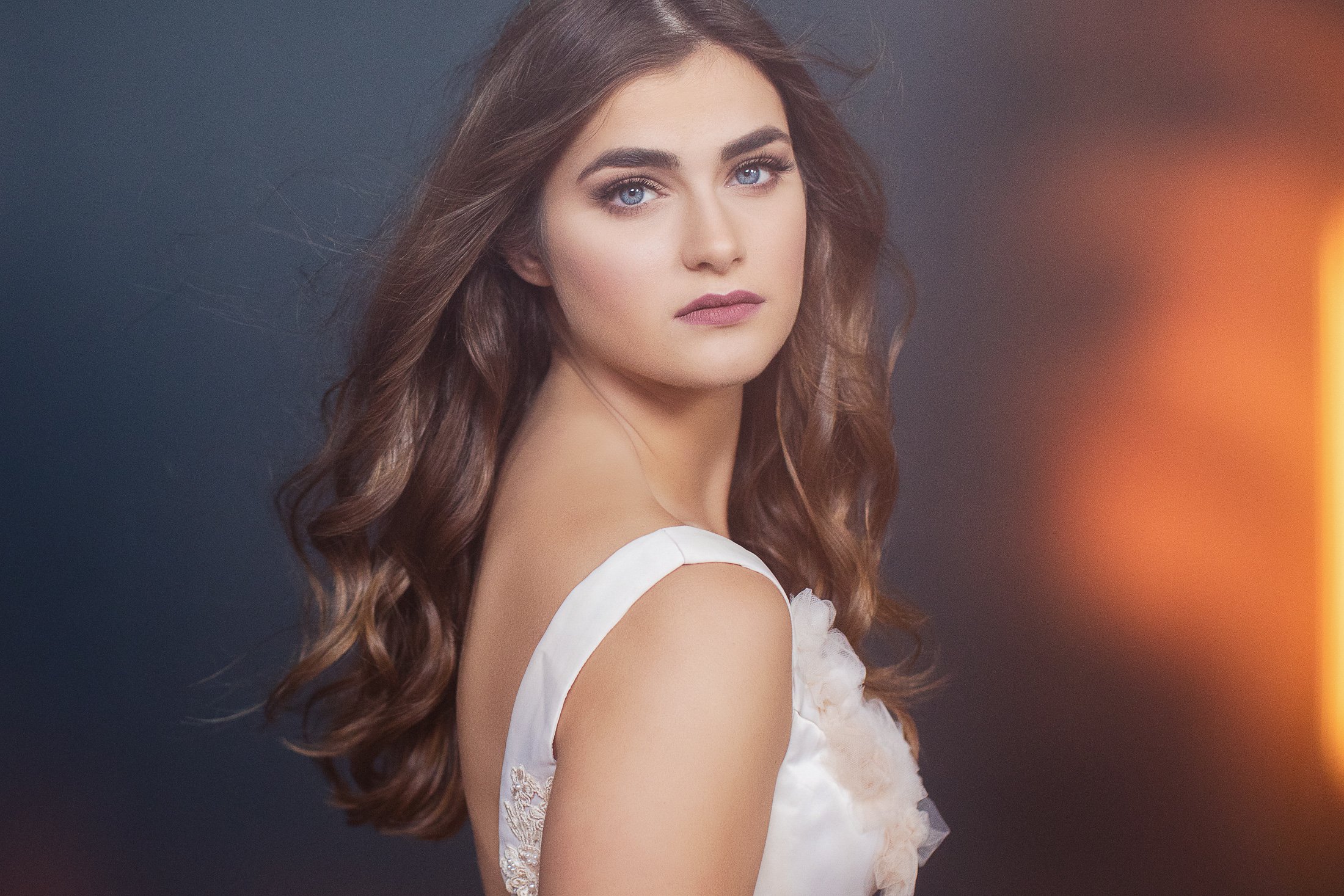 Portrait in a white gown with warm window light, AJK Images Dallas