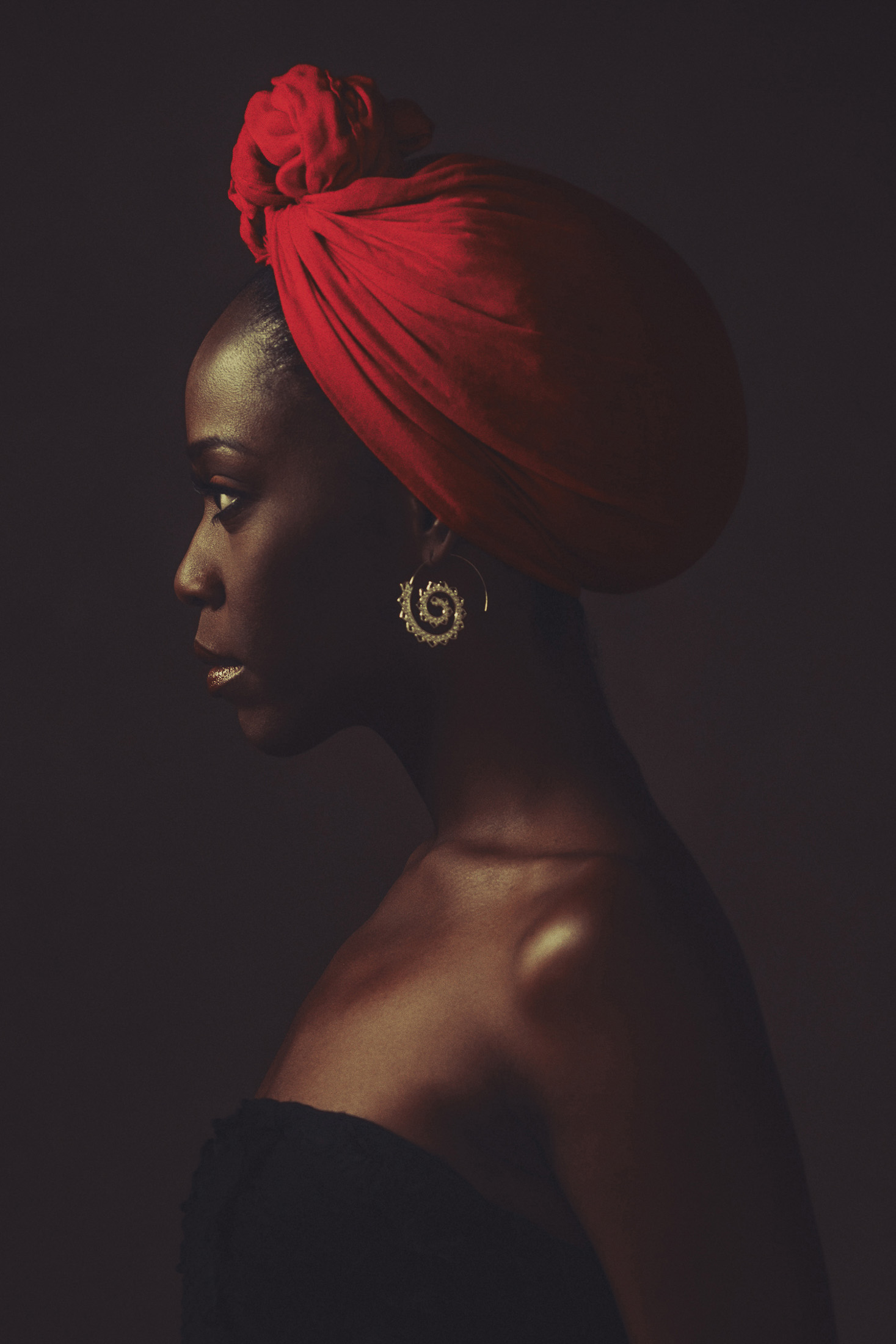The same black garment worn in a profile portrait with a red head wrap, AJK Images Dallas