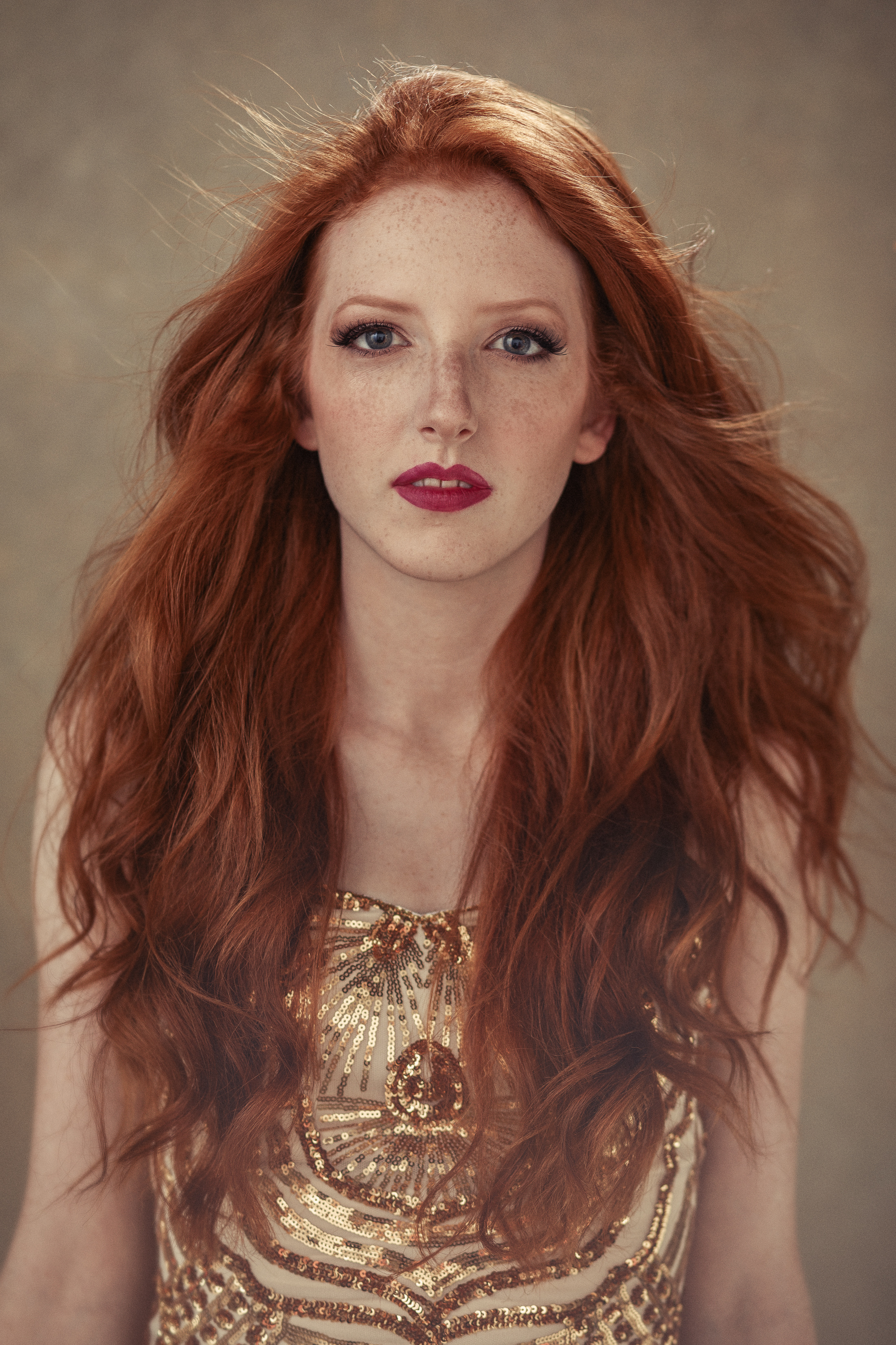 Contemporary fine art portrait commission by AJK Images, Dallas: a red-haired woman in a gold sequin gown on a hand-painted canvas