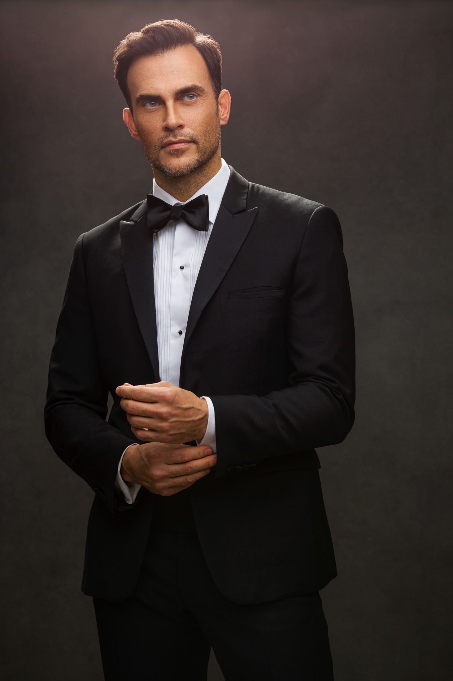 Directed studio portrait in black tie on a hand-painted canvas, AJK Images Dallas