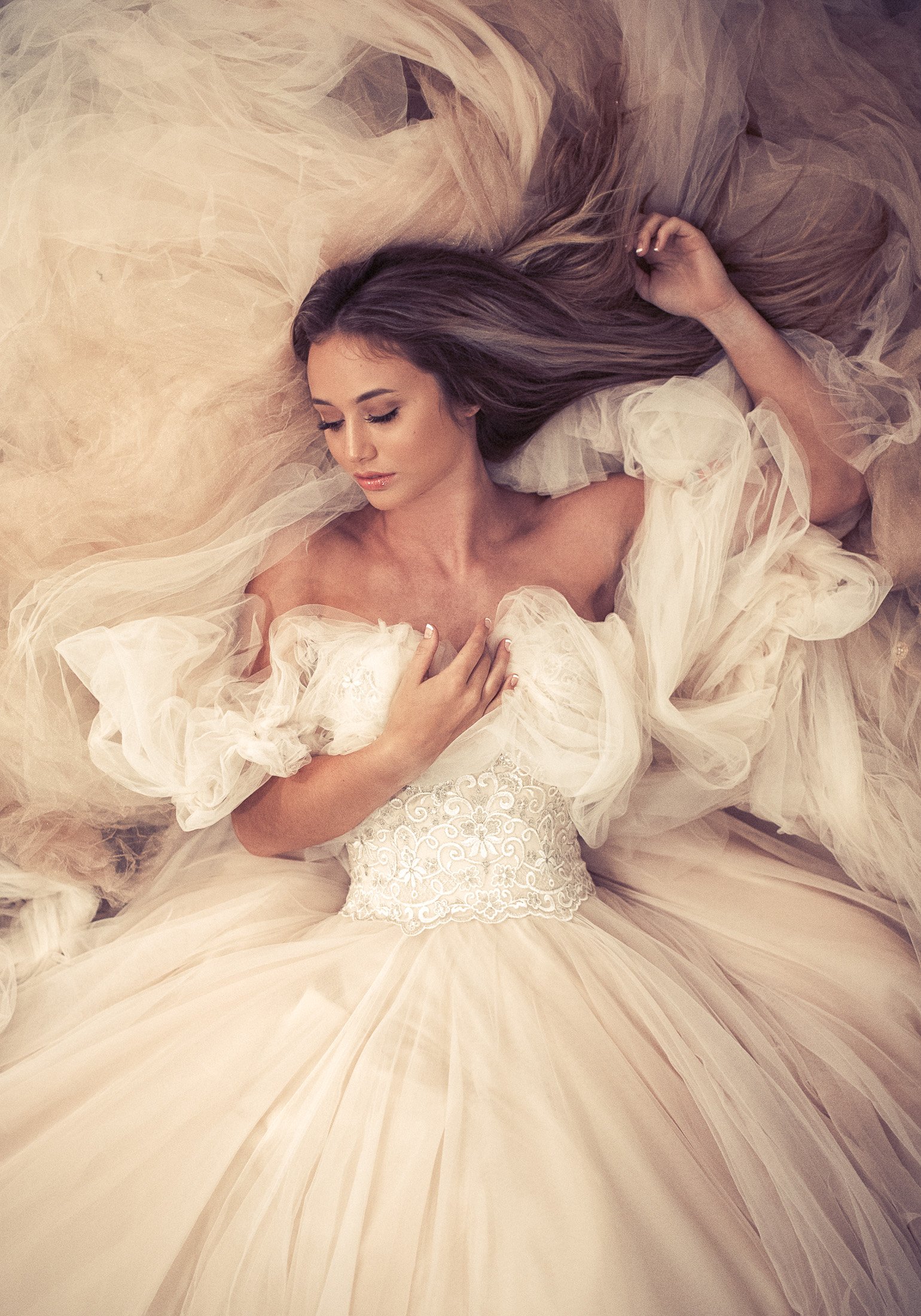Overhead portrait in a tulle gown on a bed of tulle, AJK Images Dallas