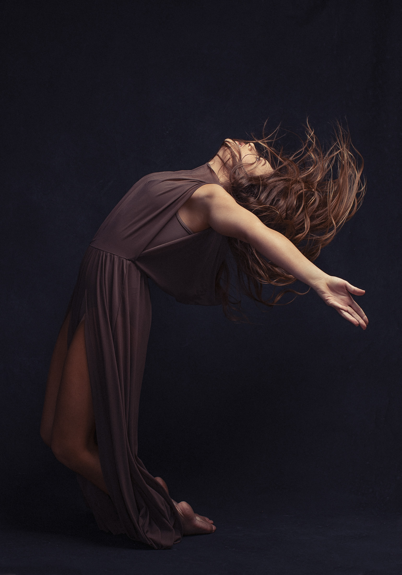 Dancer in a mauve gown, back arched, on a dark canvas, AJK Images Dallas