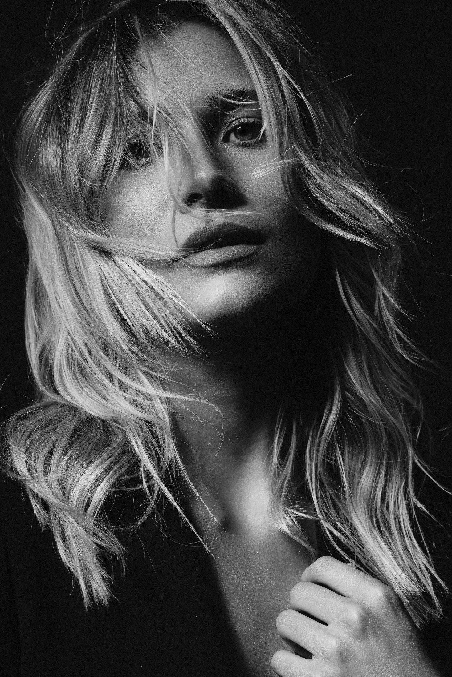 Black and white contemporary studio portrait in directional light, Dallas portrait studio AJK Images